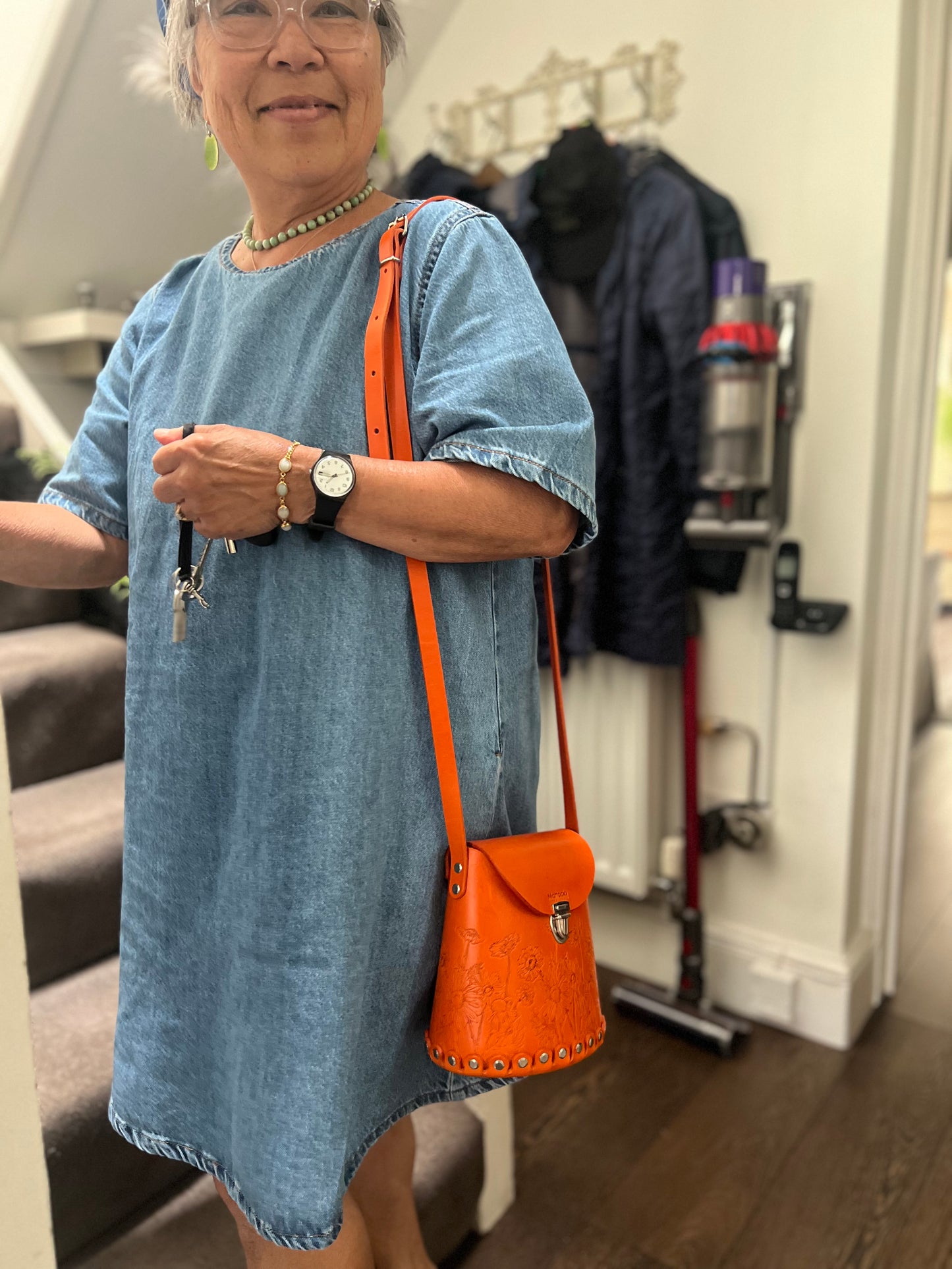 Orange leather bucket bag with “Wild Woods” original artwork