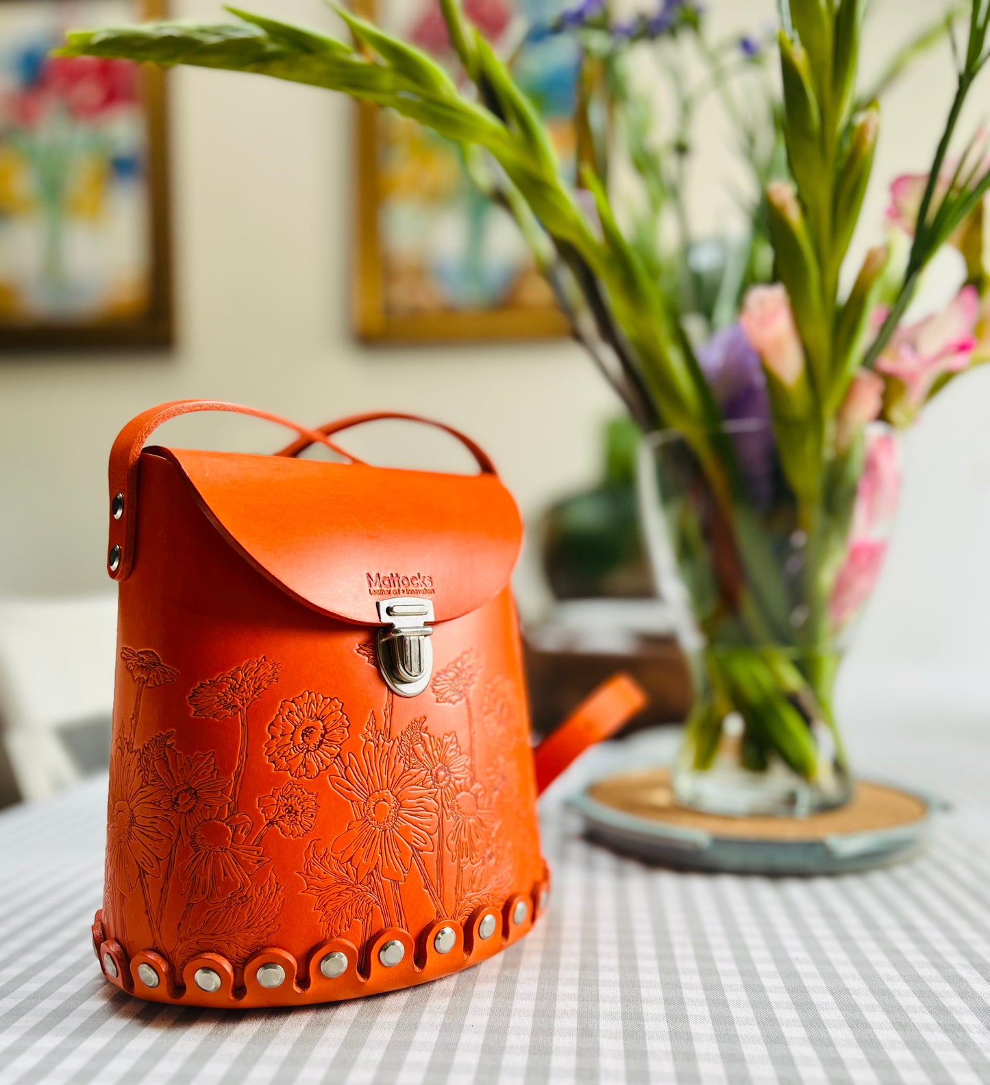 Orange leather bucket bag with “Wild Woods” original artwork
