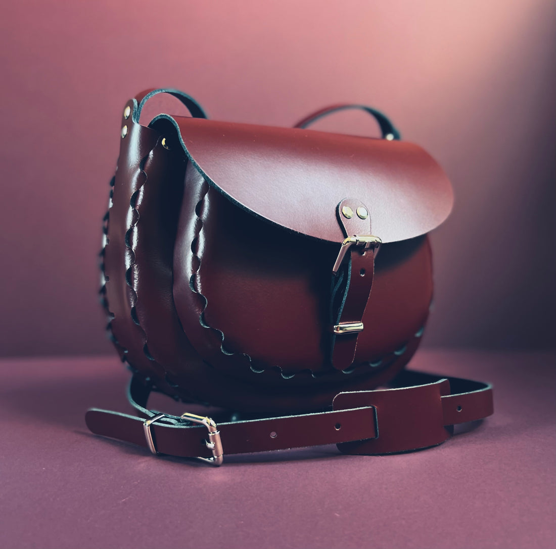 Handmade  leather saddle bags and accessories crafted in tan leather and silver chrome hardware. Limited edition innovative designs inspired by contemporary art and classic vintage styles. Saddle bags handmade in Nottingham. 