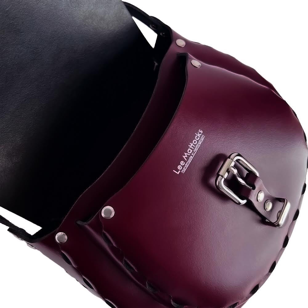 Handmade  leather saddle bags and accessories crafted in tan leather and silver chrome hardware. Limited edition innovative designs inspired by contemporary art and classic vintage styles. Saddle bags handmade in Nottingham. 